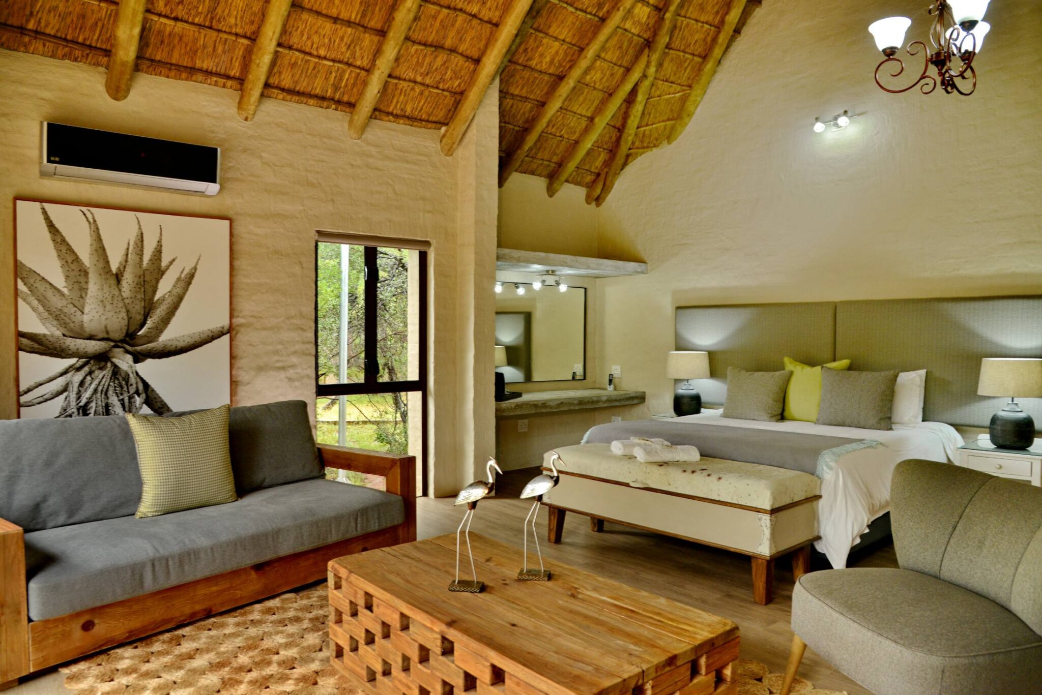 Game drive vehicle and bushveld at Lion's Den Game Lodge